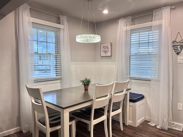 dining area featuring dark hardwood / wood-style flooring