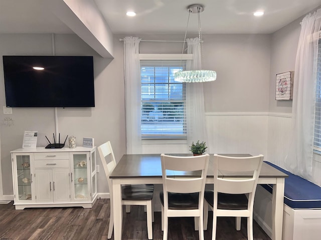 dining space with dark wood-type flooring