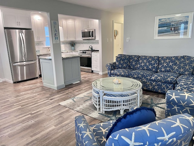 living room with light hardwood / wood-style floors