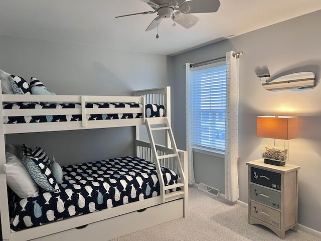 bedroom featuring ceiling fan and light carpet