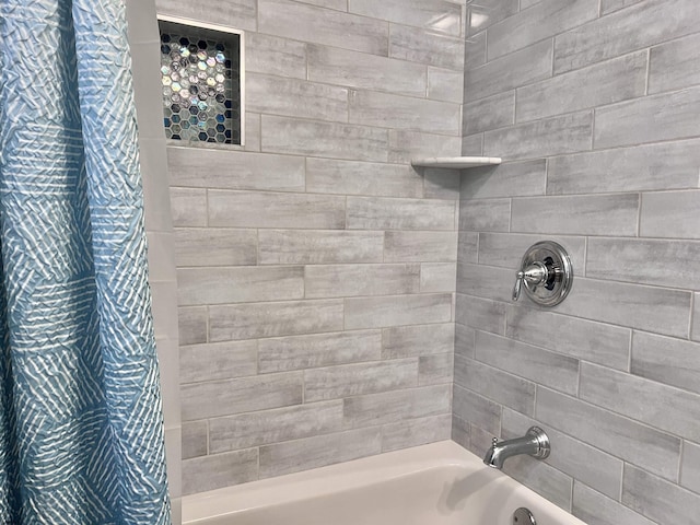 bathroom featuring shower / tub combo with curtain