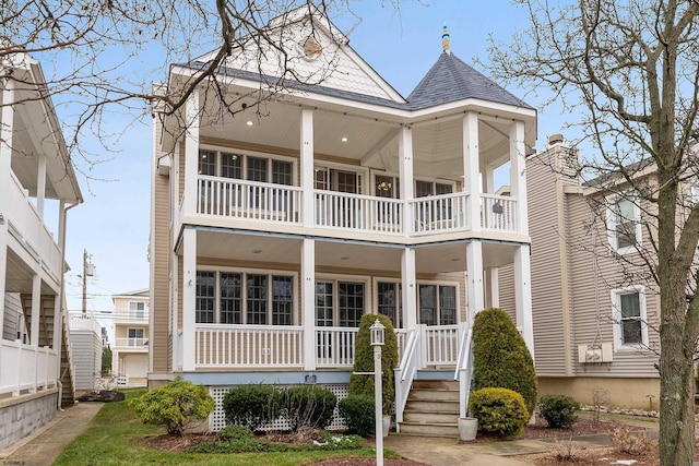 view of front of house featuring a balcony