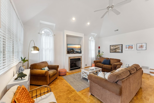 living room with vaulted ceiling and ceiling fan