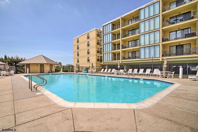 view of swimming pool with a patio area