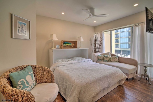 bedroom with ceiling fan and dark wood-type flooring