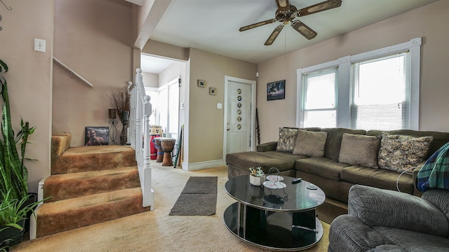 living room featuring ceiling fan and light carpet