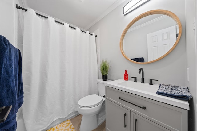 bathroom featuring toilet, vanity, ornamental molding, and tile patterned flooring