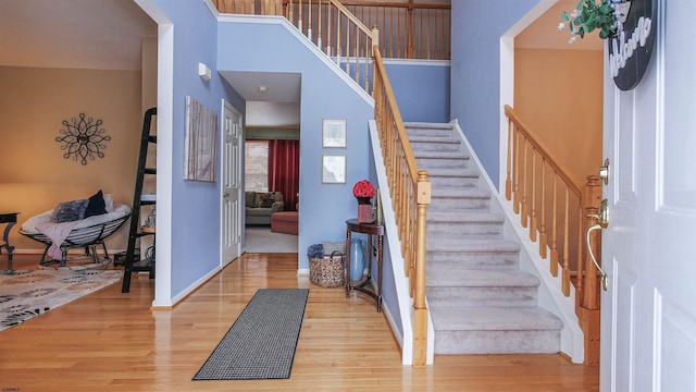 foyer entrance with hardwood / wood-style floors