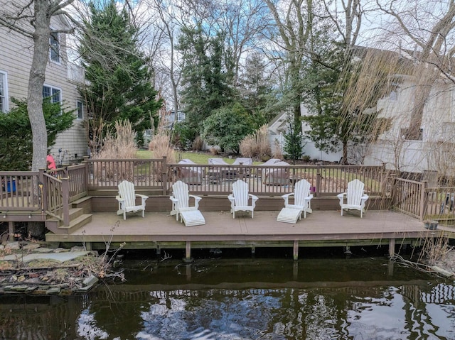 view of dock featuring a deck with water view