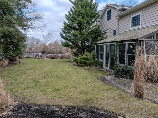 view of yard featuring a sunroom