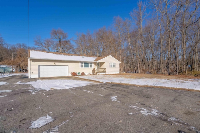 single story home featuring a garage