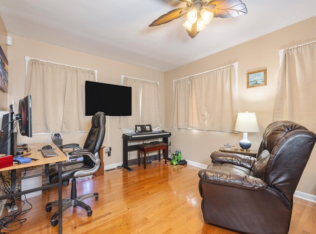 office area featuring light hardwood / wood-style floors and ceiling fan