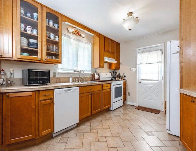 kitchen with sink and white appliances