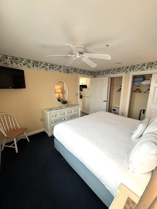 bedroom featuring white refrigerator, carpet, and ceiling fan