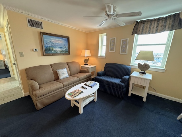 living room featuring ceiling fan and crown molding