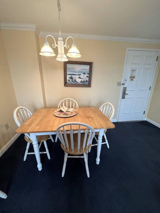 dining area featuring ornamental molding and dark colored carpet