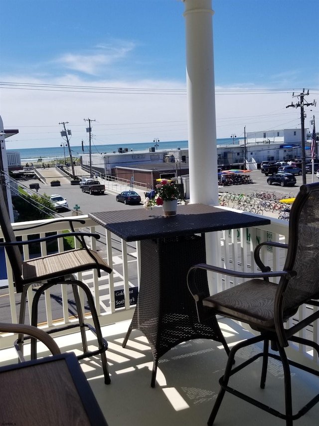 balcony featuring a water view