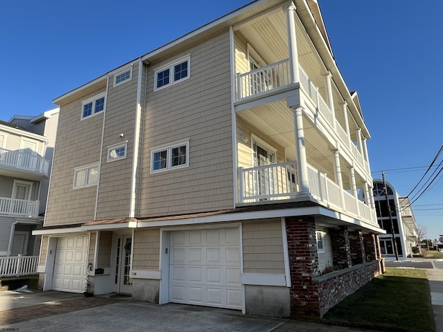 rear view of house featuring an attached garage