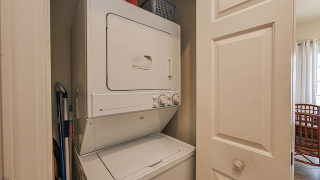 laundry area featuring laundry area and stacked washer / drying machine