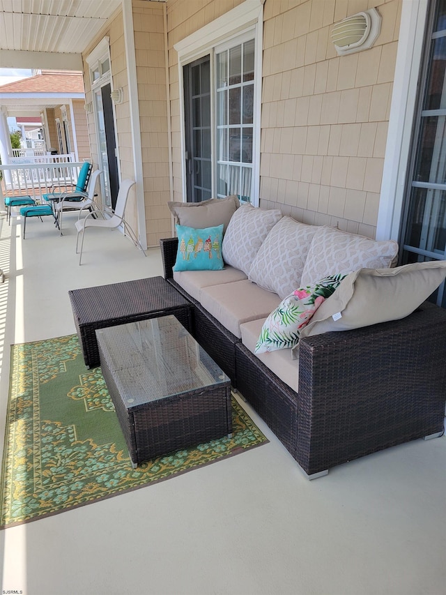 view of patio / terrace with an outdoor living space and covered porch