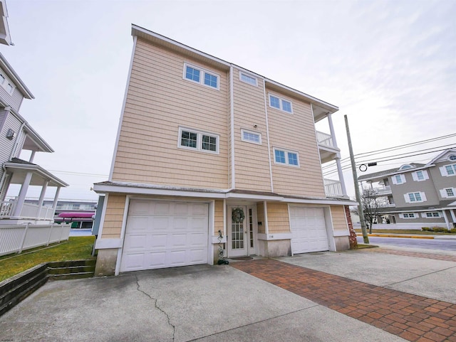 view of front of property with an attached garage and concrete driveway