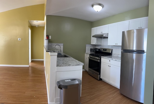 kitchen with sink, white cabinets, tasteful backsplash, and appliances with stainless steel finishes