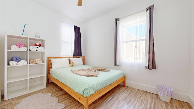 bedroom featuring ceiling fan and wood-type flooring