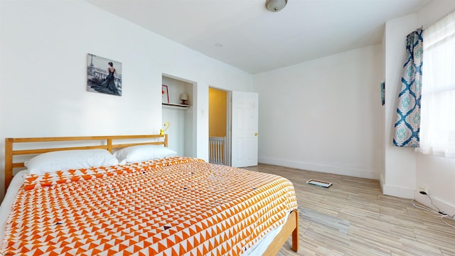 bedroom with light wood-type flooring