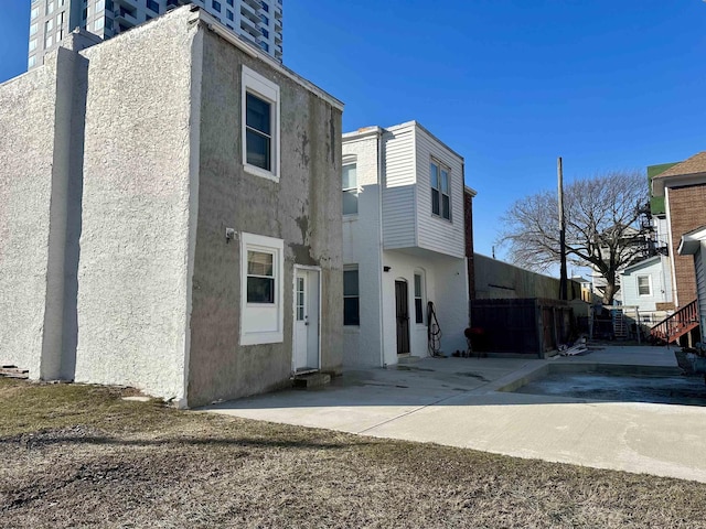 back of house with a patio area