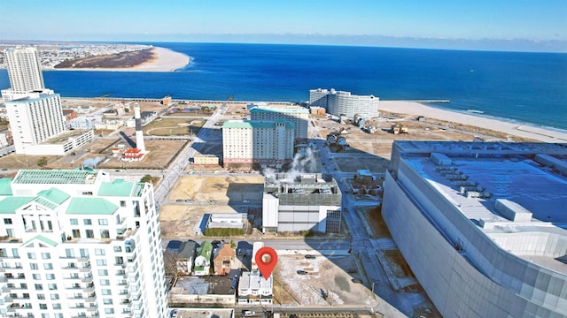 birds eye view of property featuring a view of the beach and a water view