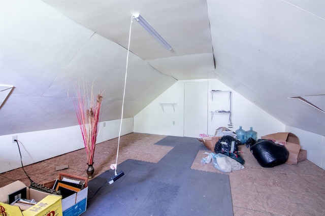 additional living space featuring lofted ceiling