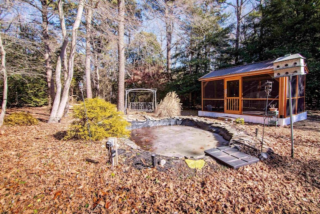 view of yard featuring a sunroom