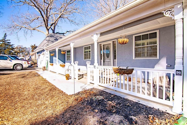 doorway to property featuring covered porch