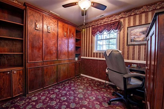 unfurnished office featuring ceiling fan