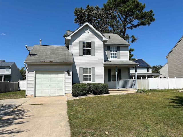 view of front of house with a garage, a front yard, and covered porch