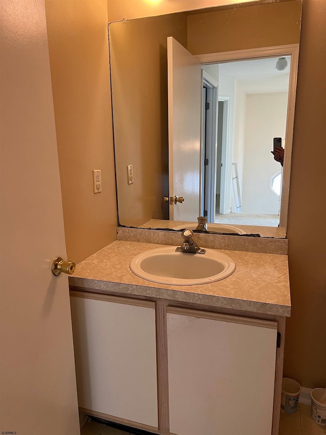 bathroom with vanity and tile patterned flooring