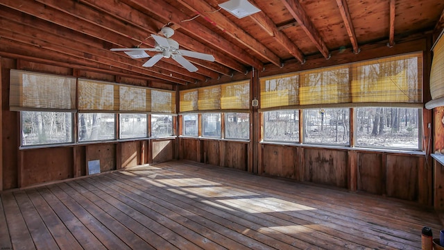 unfurnished sunroom featuring plenty of natural light and ceiling fan