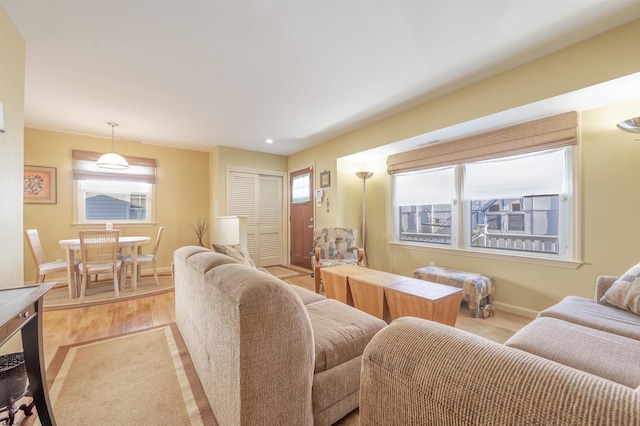 living room featuring plenty of natural light and light wood-type flooring