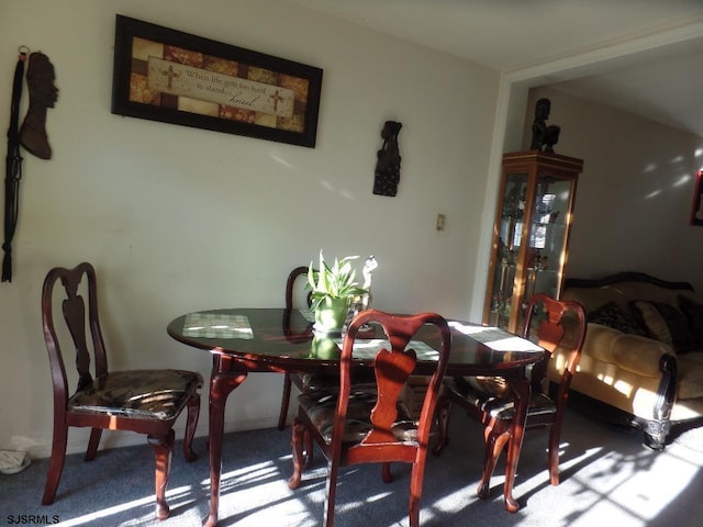 dining room featuring carpet