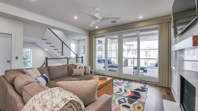 living room featuring french doors, ceiling fan, and hardwood / wood-style floors