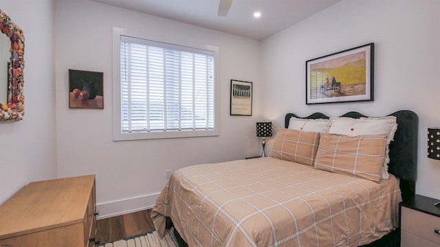 bedroom featuring wood-type flooring and ceiling fan