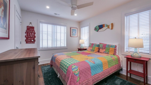 bedroom featuring dark hardwood / wood-style flooring and ceiling fan