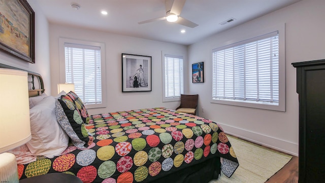 bedroom featuring hardwood / wood-style flooring and ceiling fan