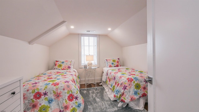 bedroom featuring vaulted ceiling and dark wood-type flooring