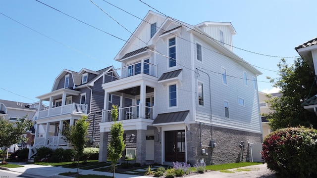 view of front of house featuring a balcony