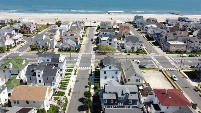 aerial view with a water view and a view of the beach