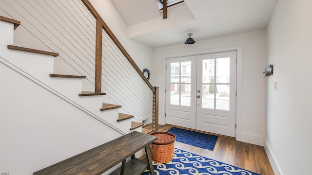 foyer featuring french doors and wood-type flooring