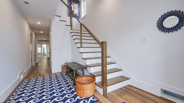 stairway featuring hardwood / wood-style flooring