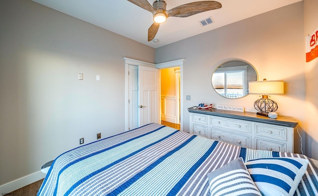 bedroom with dark wood-type flooring and ceiling fan