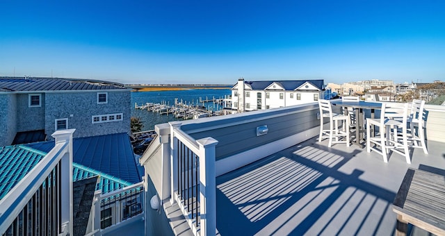 wooden terrace with a water view